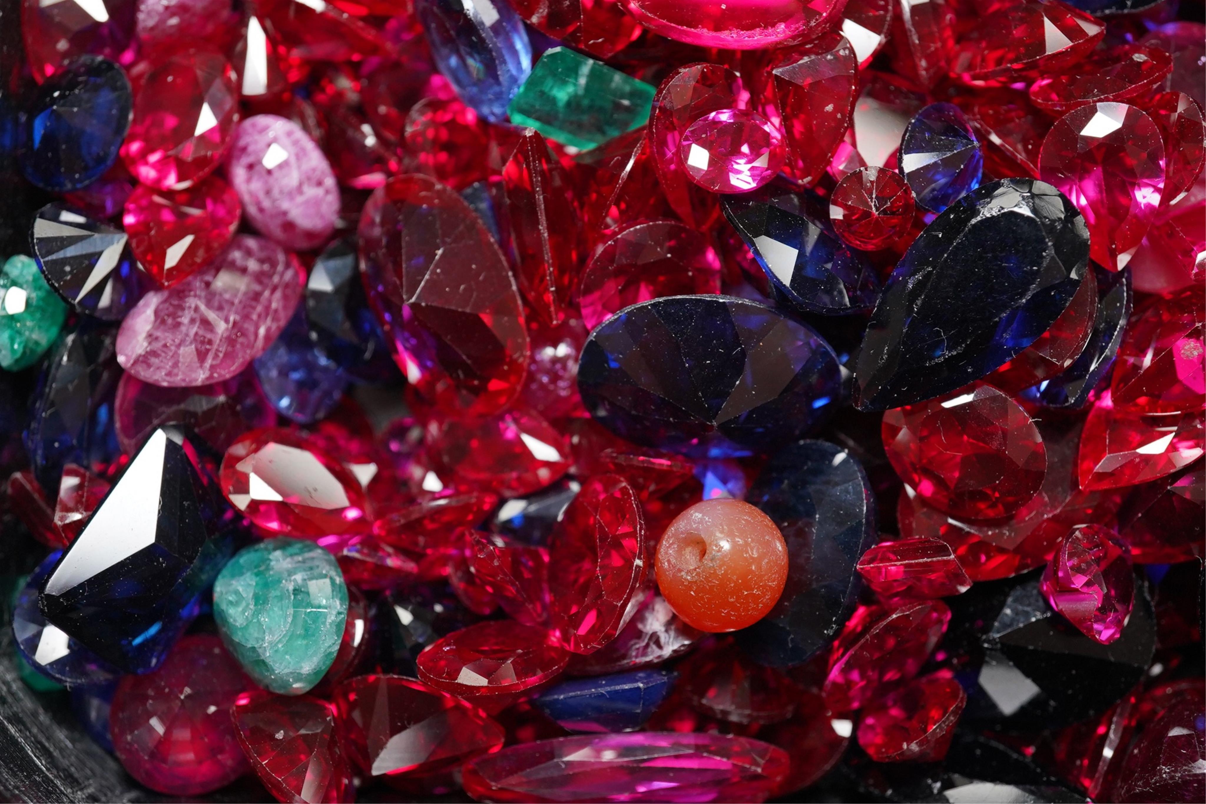 A quantity of assorted unmounted coloured gemstones. Condition - poor to fair